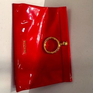 Bright Patent red leather clutch